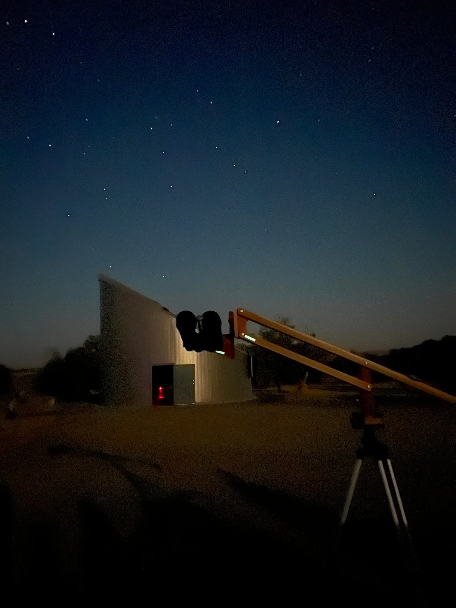 The public observatory building under a brilliant starry night sky at Bruneau Dunes State Park in Idaho.