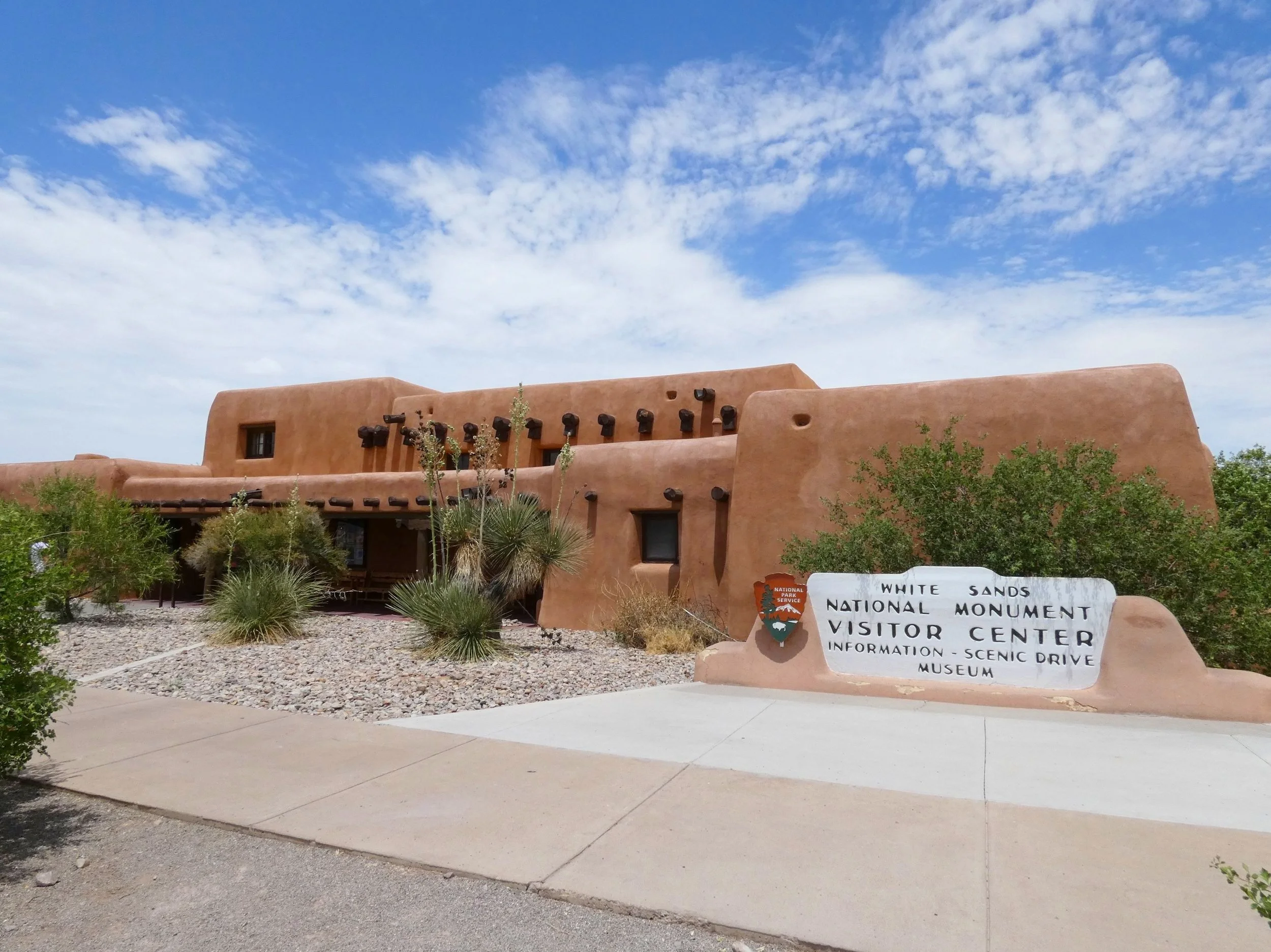 The historic adobe Pueblo Revival visitor center at the entrance of White Sands National Park in New Mexico.