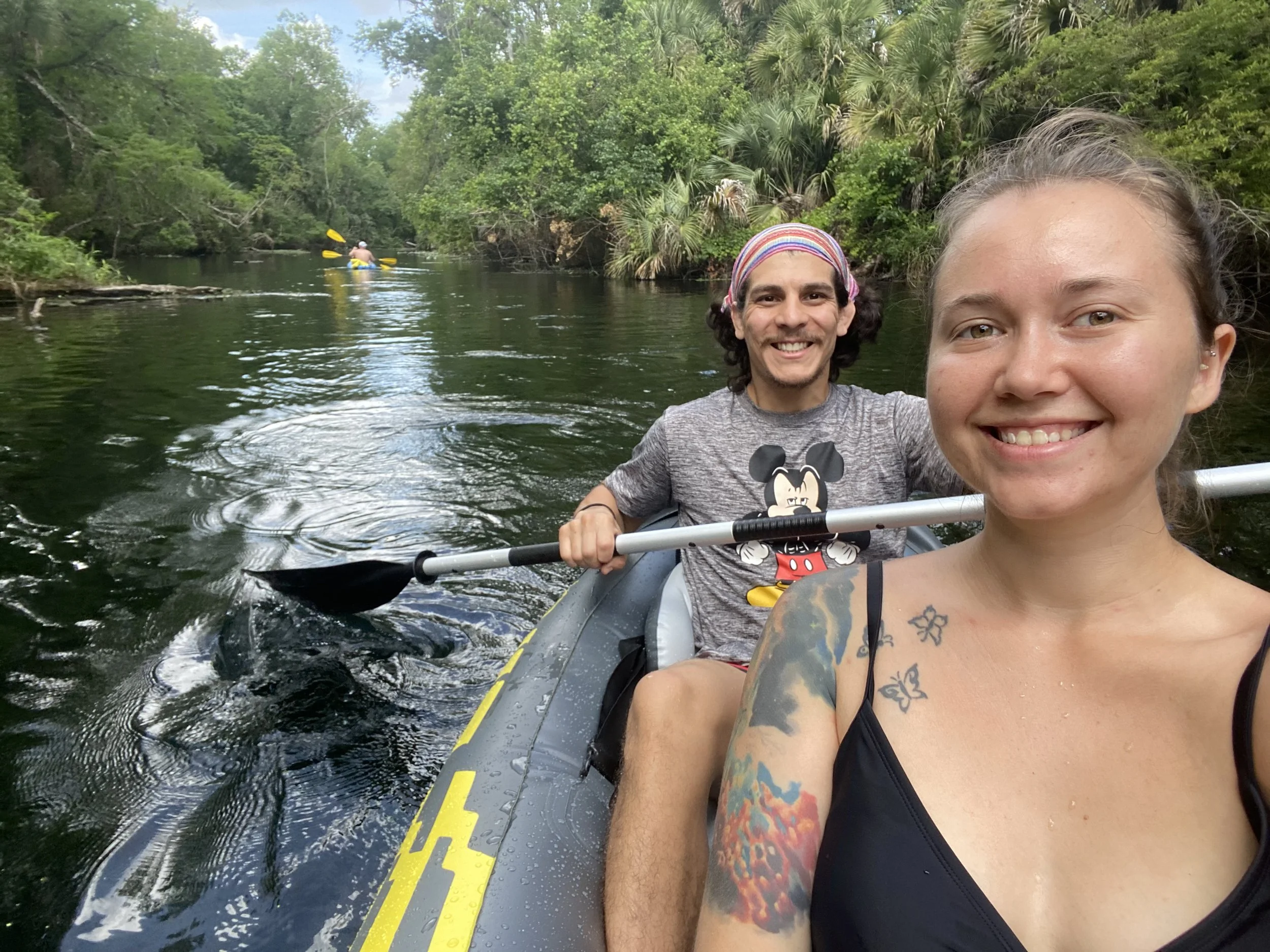 A couple taking a selfie together while kayaking on the scenic water at Wekiwa Springs State Park.