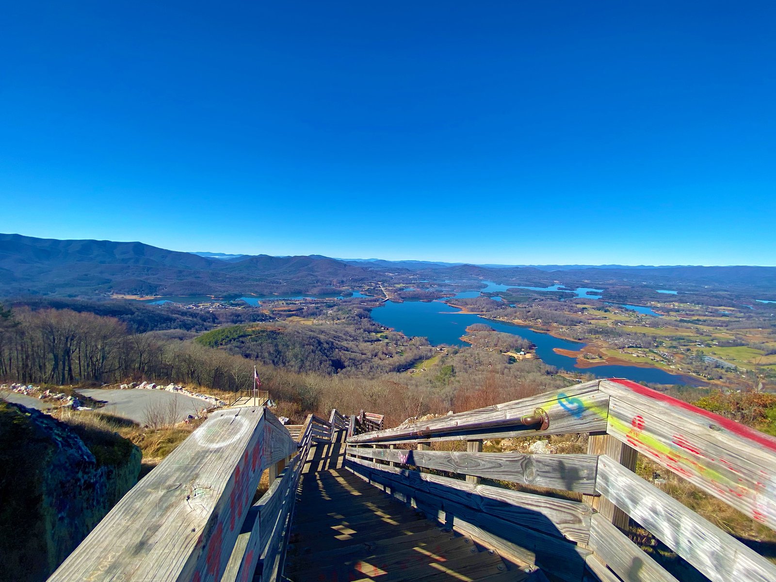 photo steps leading down with view of lake and town