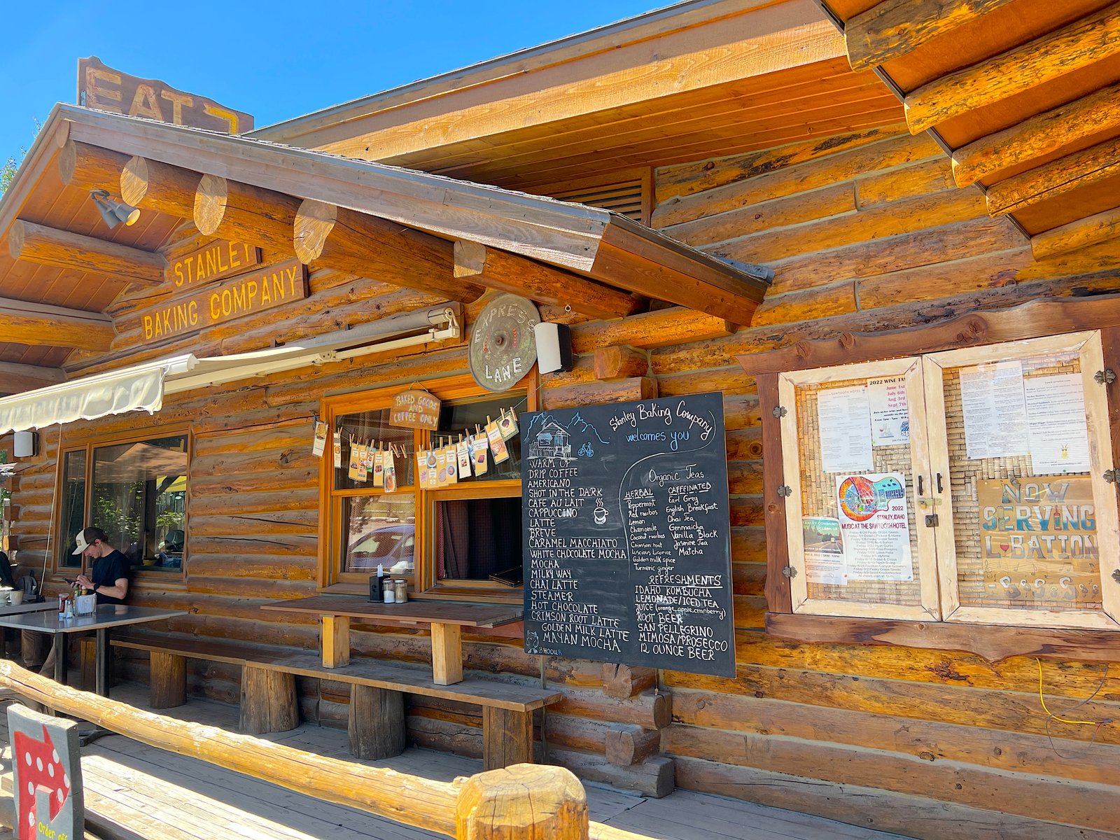 The charming log cabin storefront of the Stanley Baking Company and Cafe in downtown Stanley, Idaho.