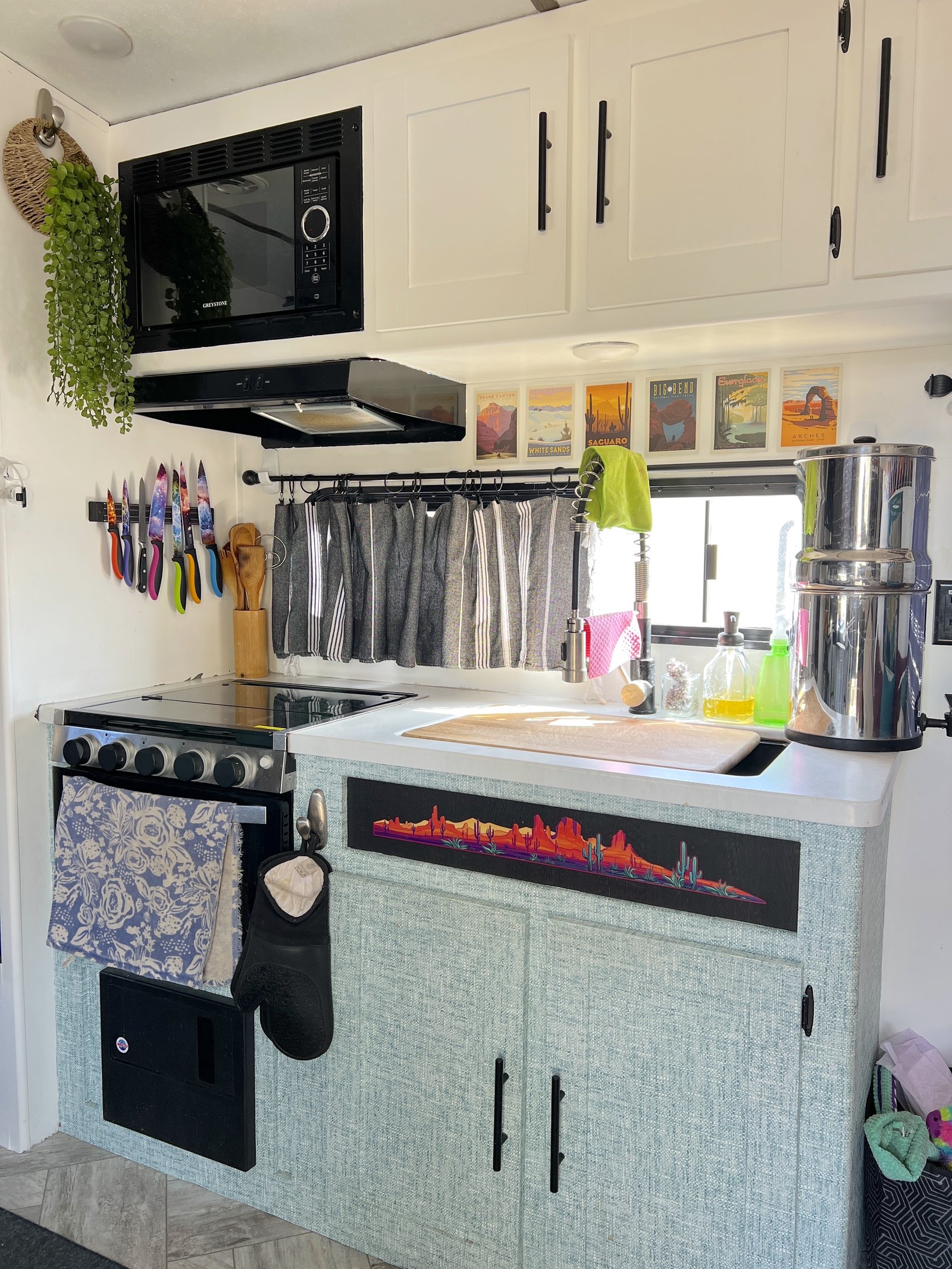 A final view of a completed no-sew curtain installed on a second window in a camper interior.