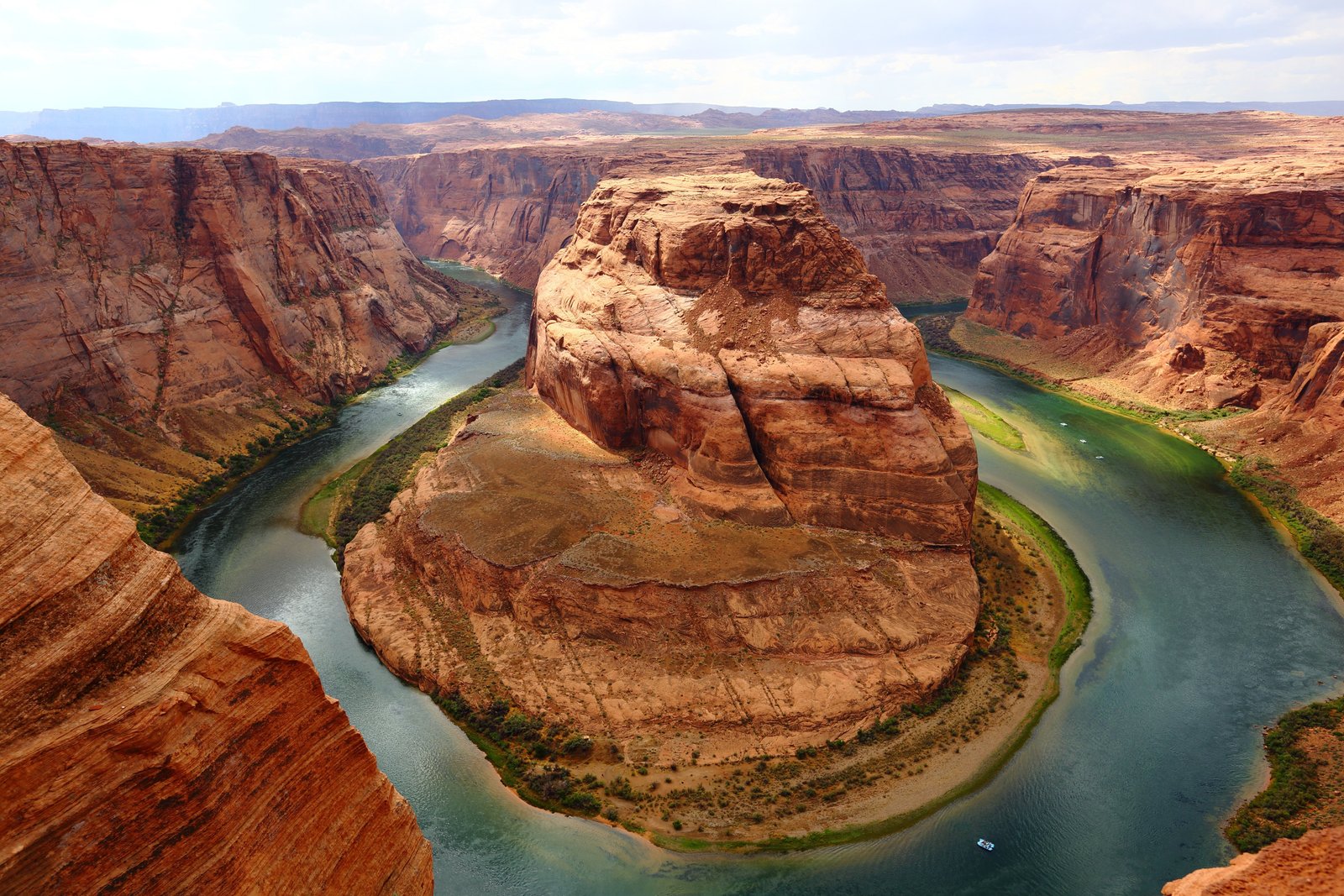view of horseshoe bend shape canyon with a blue river running through it