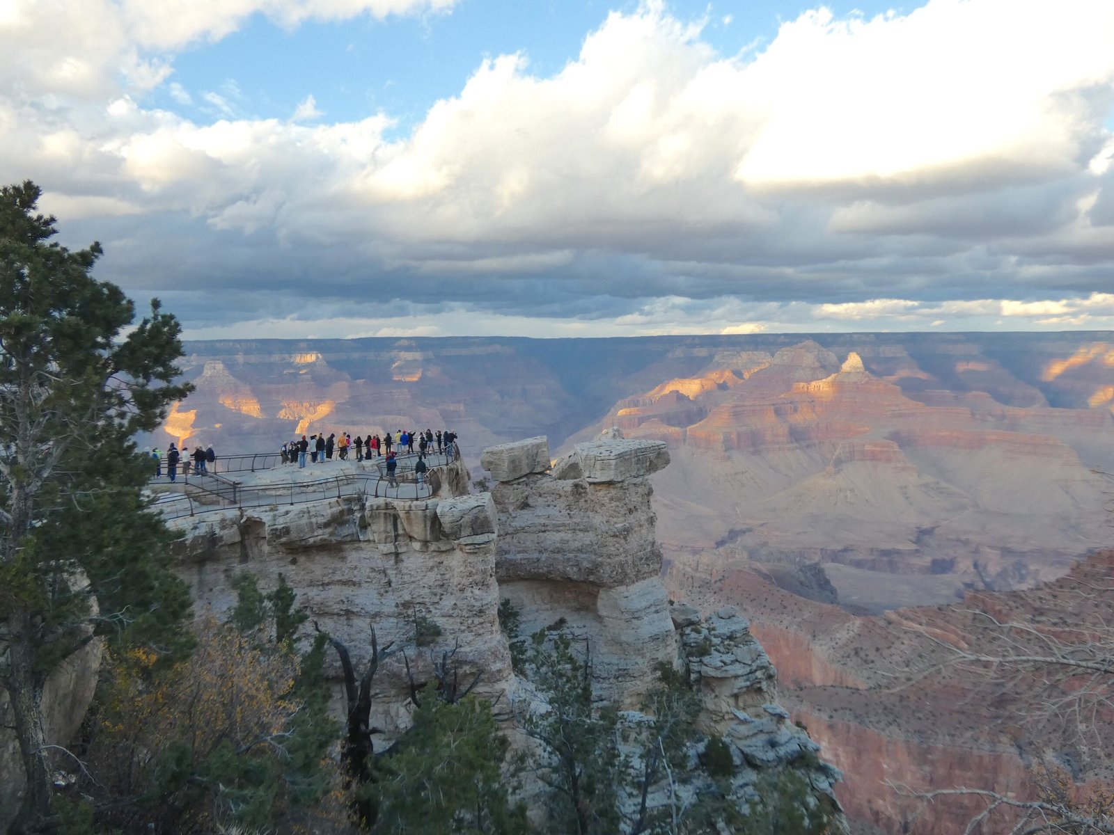 view of visitors at Mather point with Grand Canyon in the distance