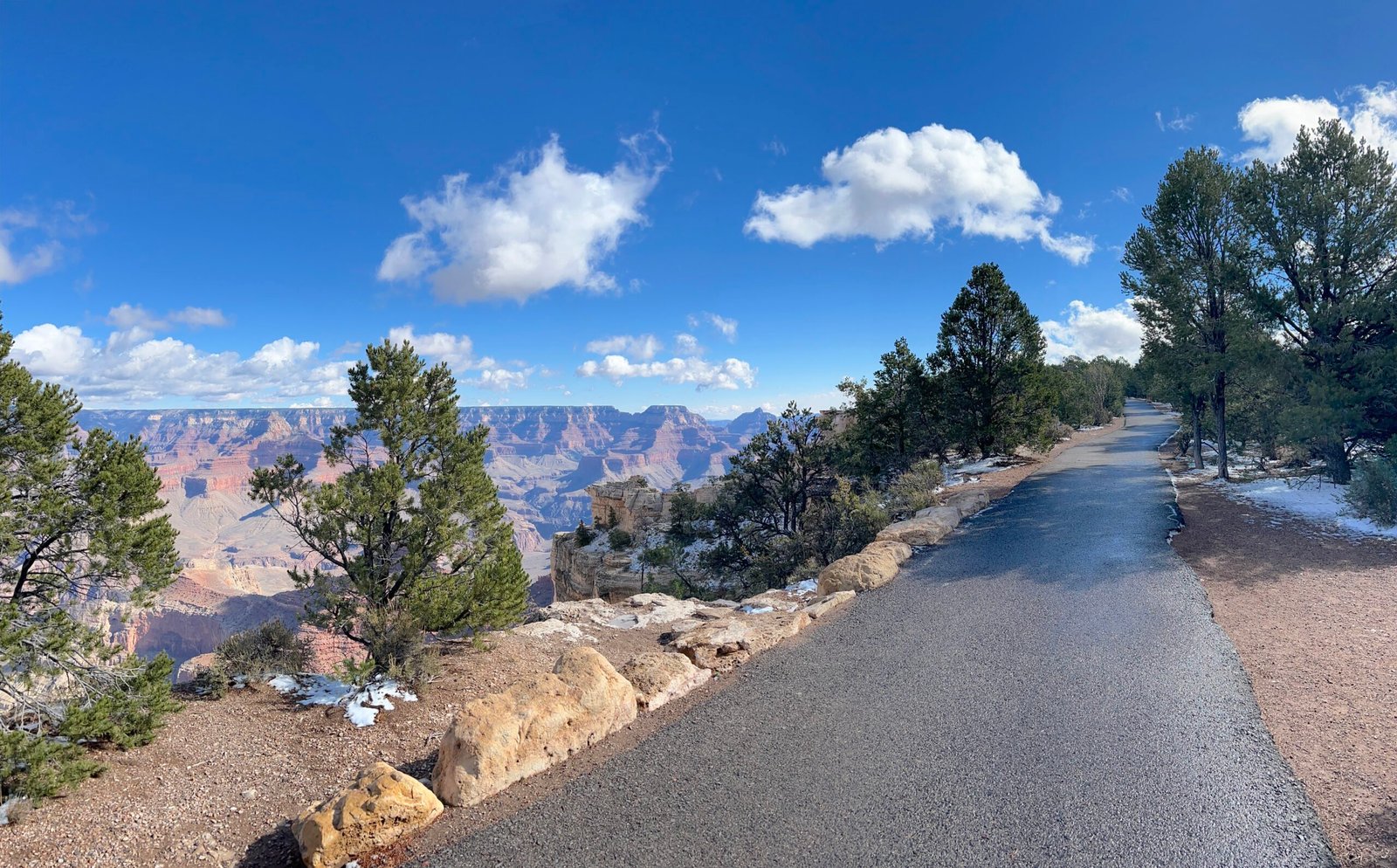 photo of rim trail with Grand Canyon in the background